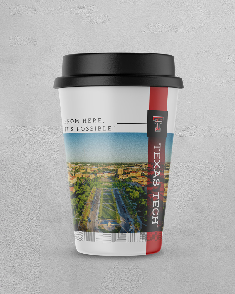 A coffee cup featuring a large image of campus            and decorated with complementary elements and            branded with the Texas Tech logos.