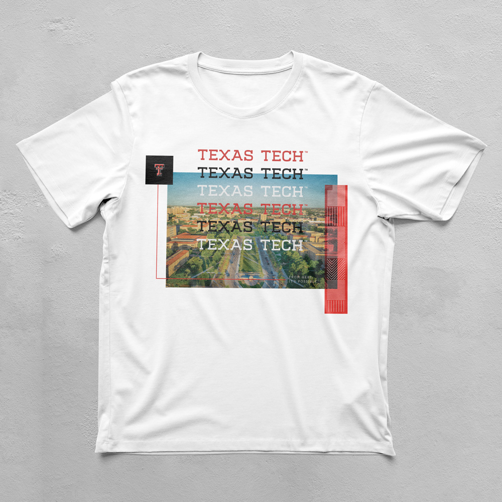 A white tshirt with a color photo of campus. The image is           overlaid with a repeating Texas Tech wordmark, a Double T,           and decorative line elements. The overlaid elements break           the boundry of the photograph.