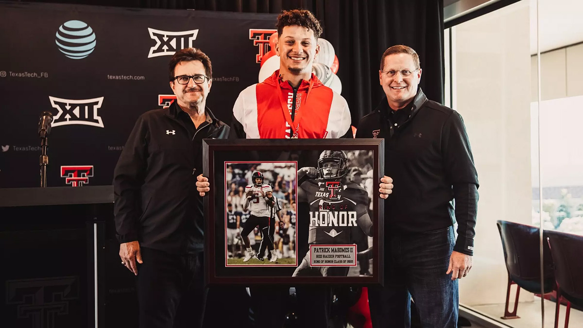 Patrick Mahomes with commemorative plaque