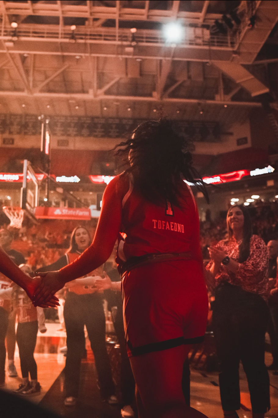 Basketball player stepping onto the court.