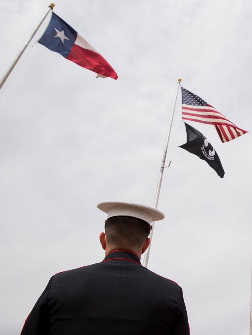 Veteran looks at American flag