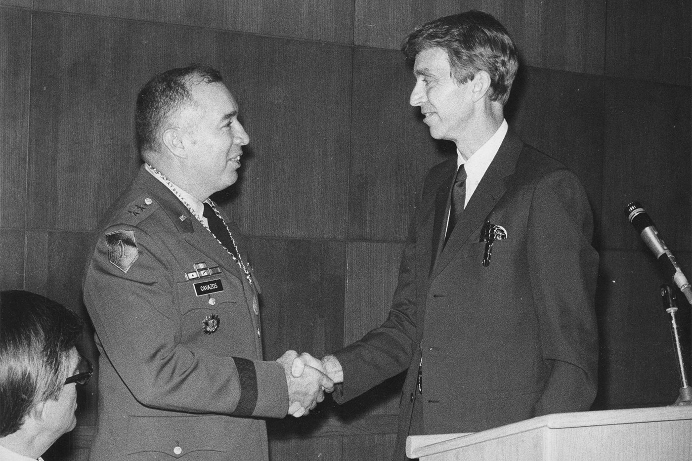 Gen. Cavazos shakes hands with then-Texas Tech President Cecil Mackey in 1976, when Cavazos was named a distinguished alumnus. 