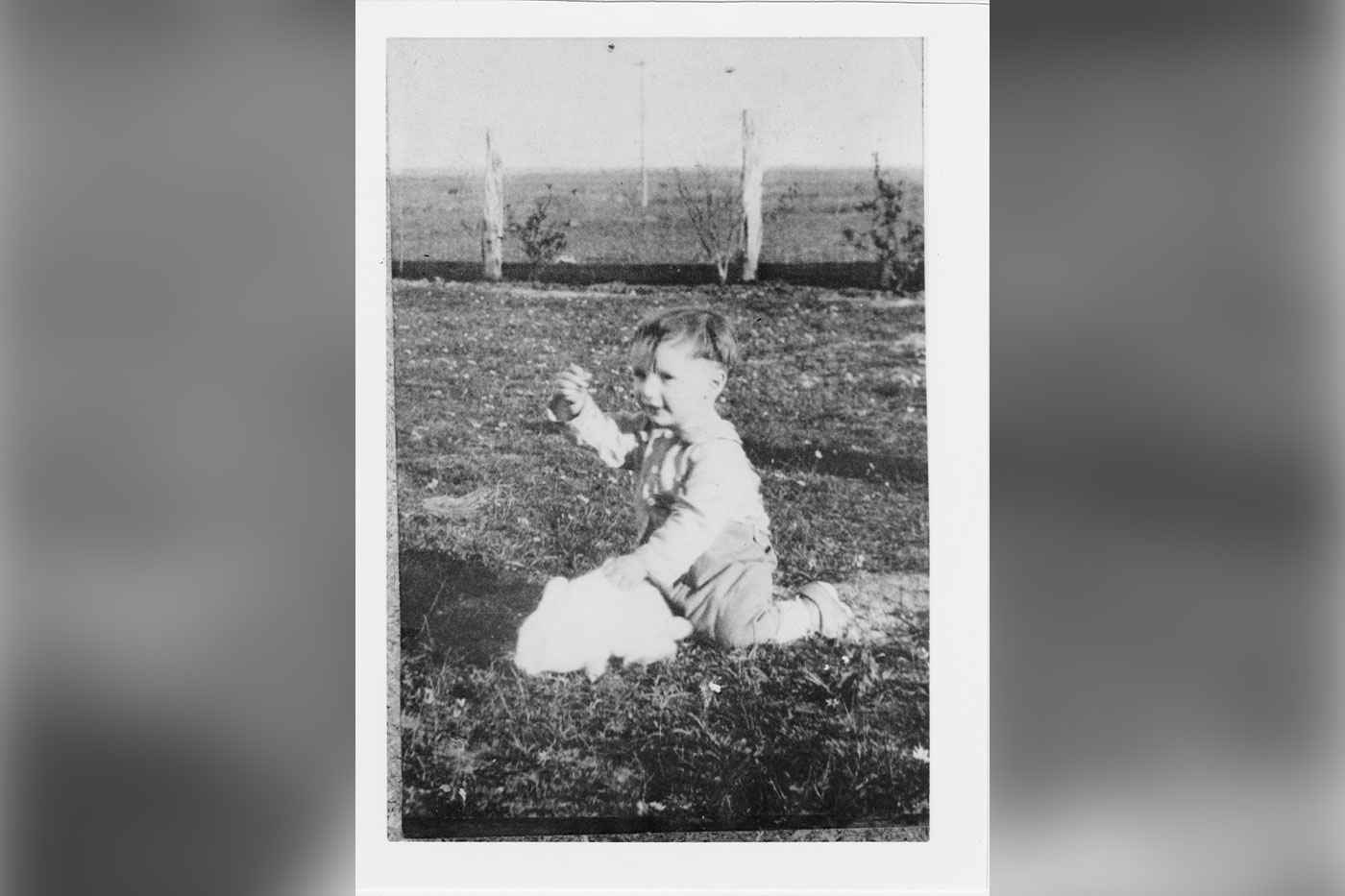 Lauro, age 2, plays outside his home on King Ranch. 