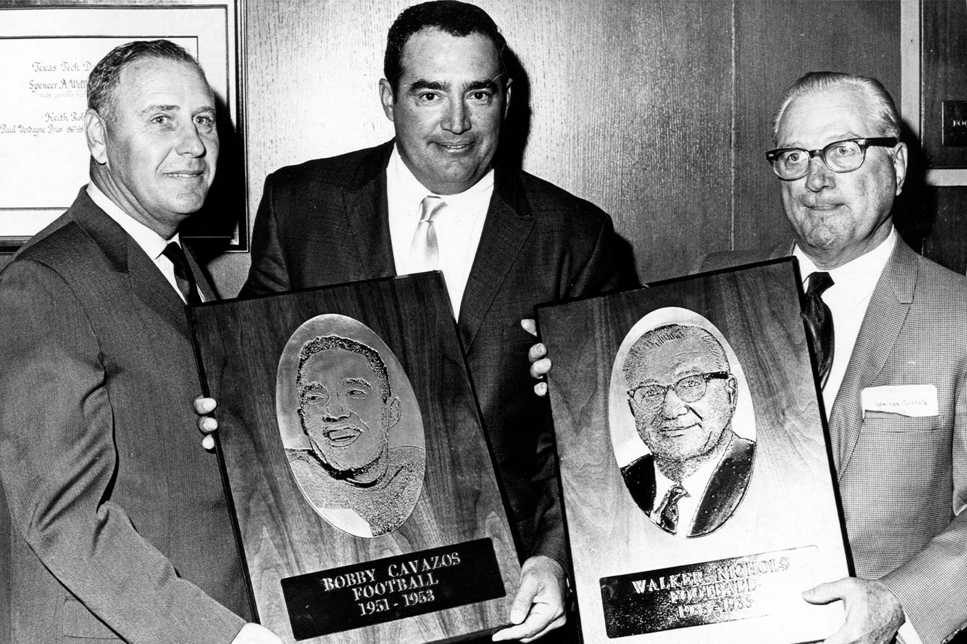 Bobby, middle, and Walker Nichols receive plaques from the Dads Association, now called the Texas Tech Parents Association. 