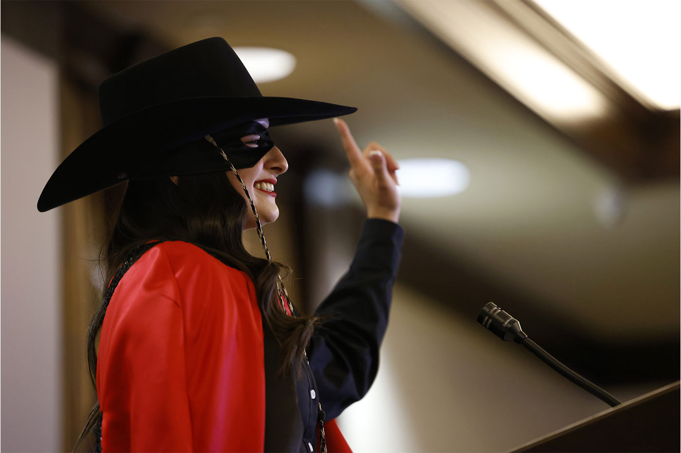 Ellie Brown passes the reins to Rose Rosas.