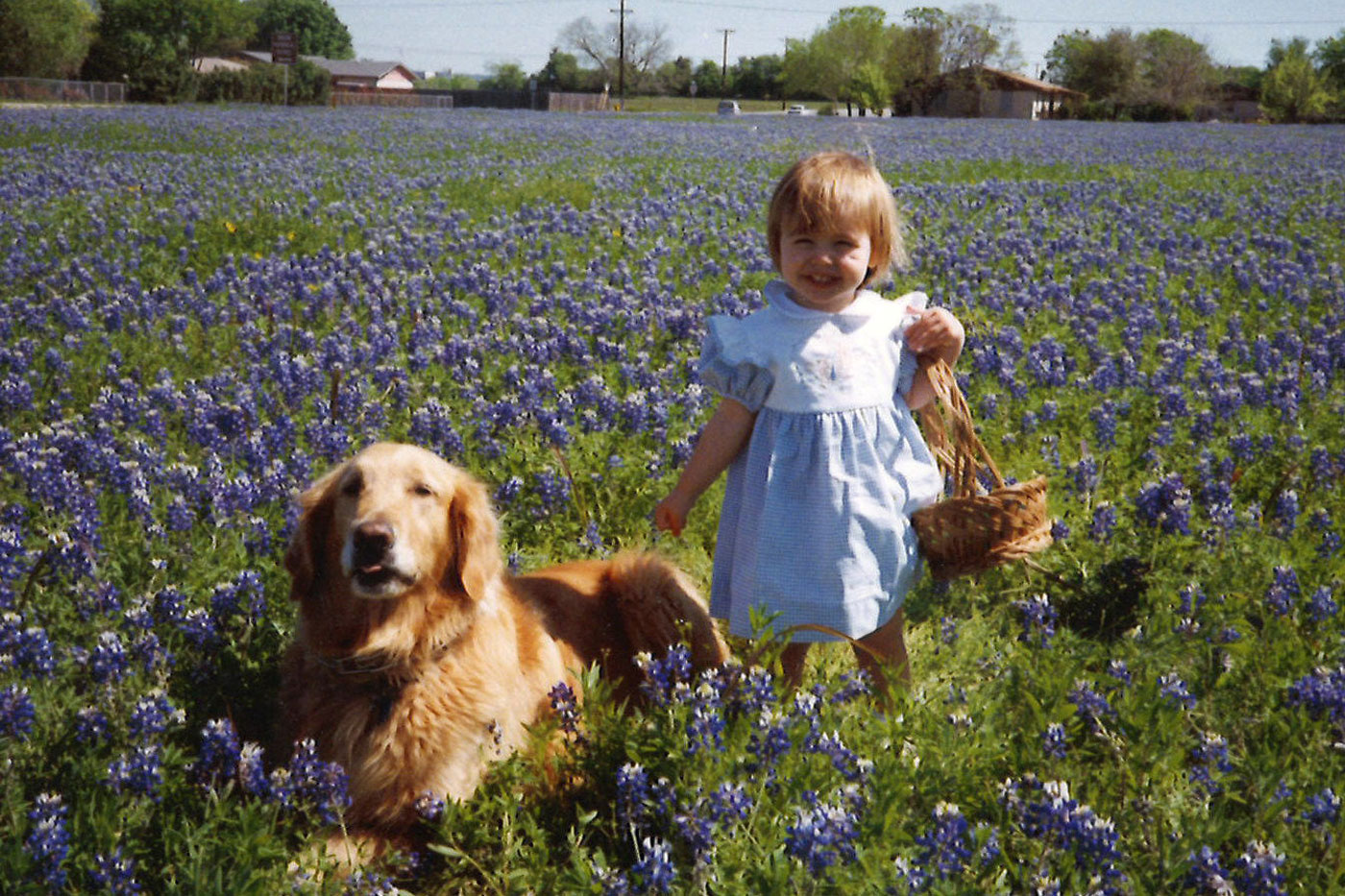 Megan Sprague with her dog in Bluebonnets