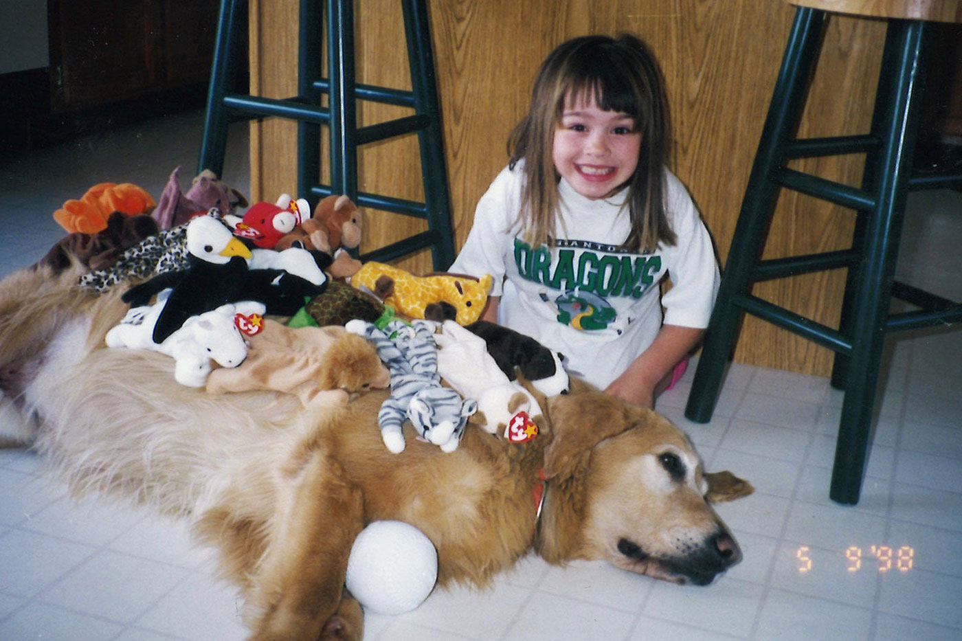 Megan Sprague with her dog and stuffed animals