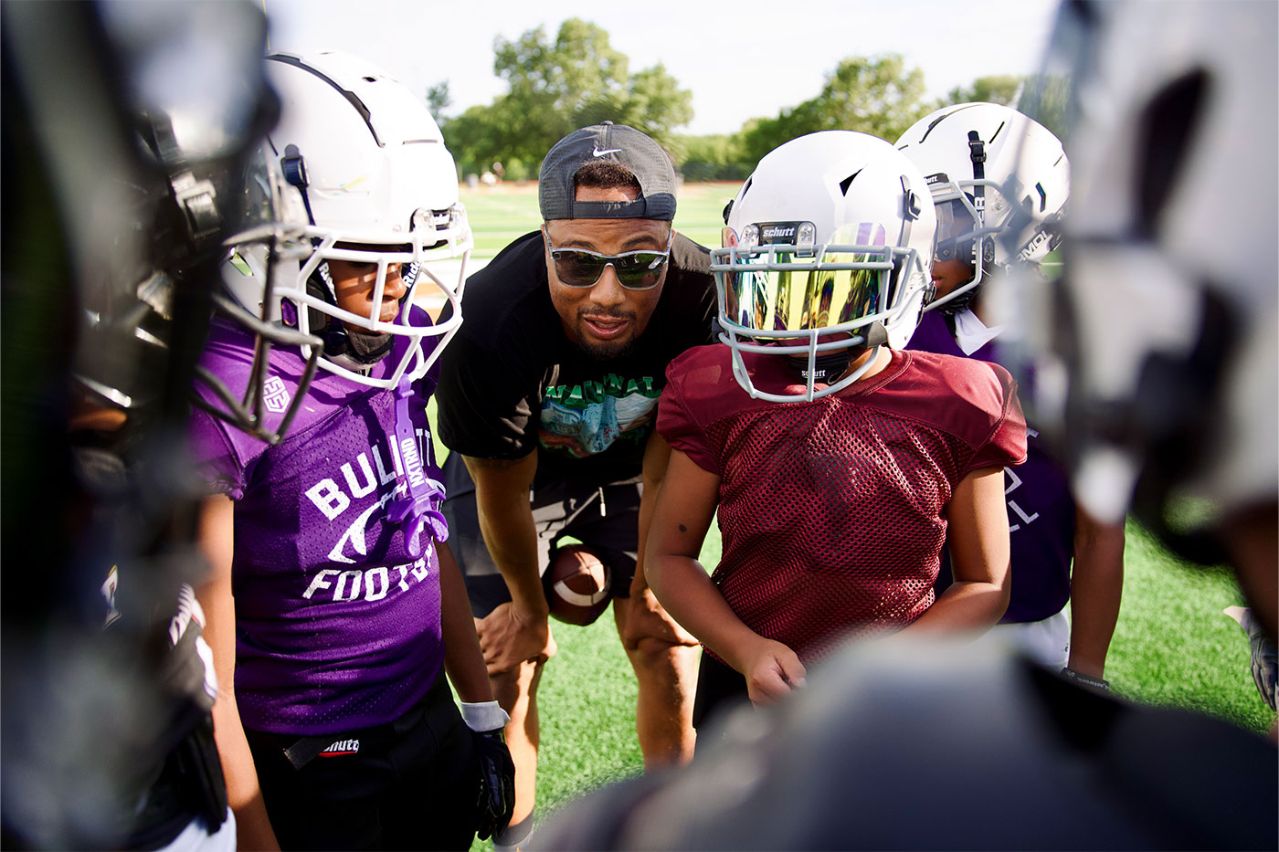 Terrance in the huddle with youngsters.