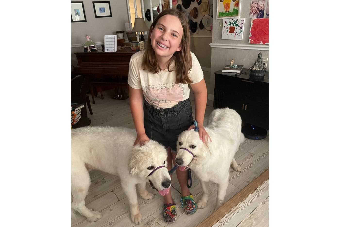 Daynne with their two Great Pyrenees, Dandelion and Kayumi 