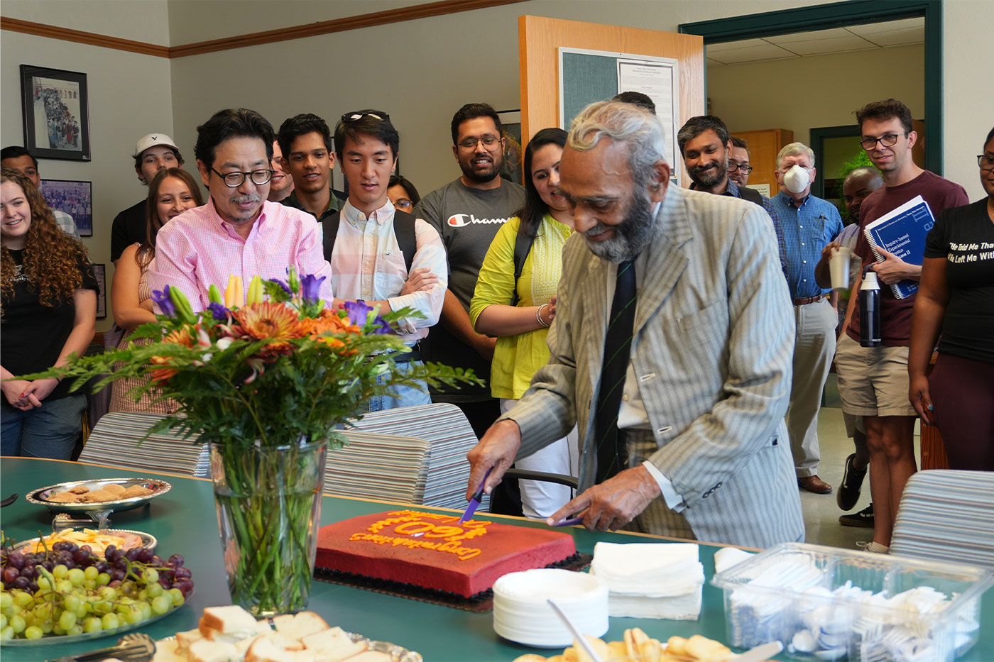 Lodhi cutting his celebration cake. 