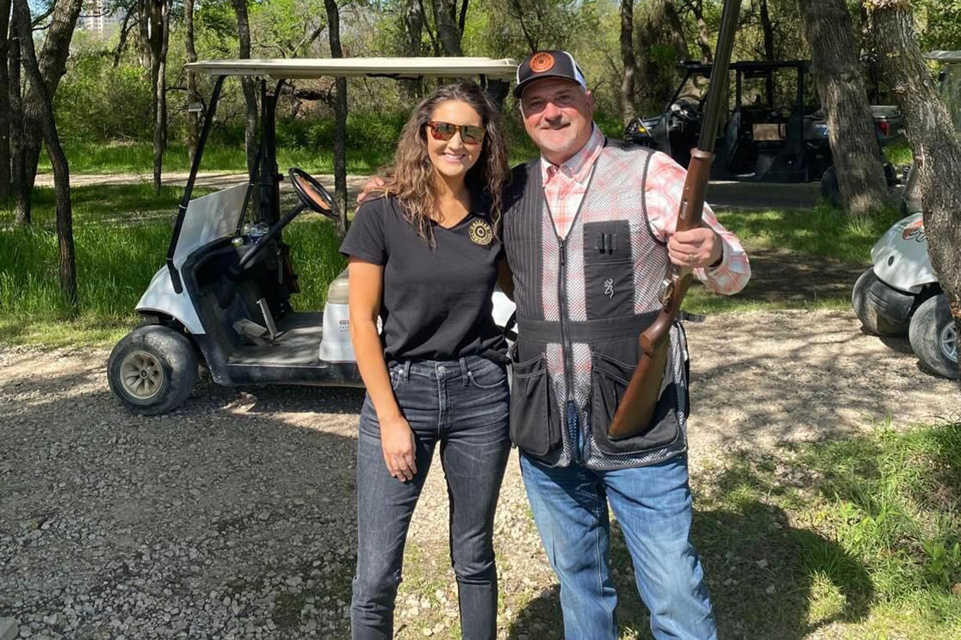 McLain and her dad, Brian Grant, at a Caliber skeet shooting event.