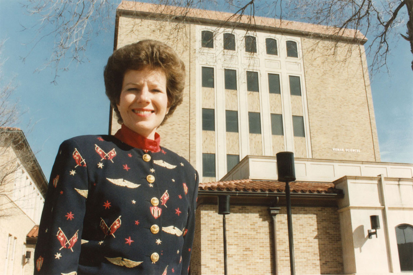 Haley poses outside the renamed Human Sciences building in 1996. Image courtesy of the Lubbock Avalanche-Journal.