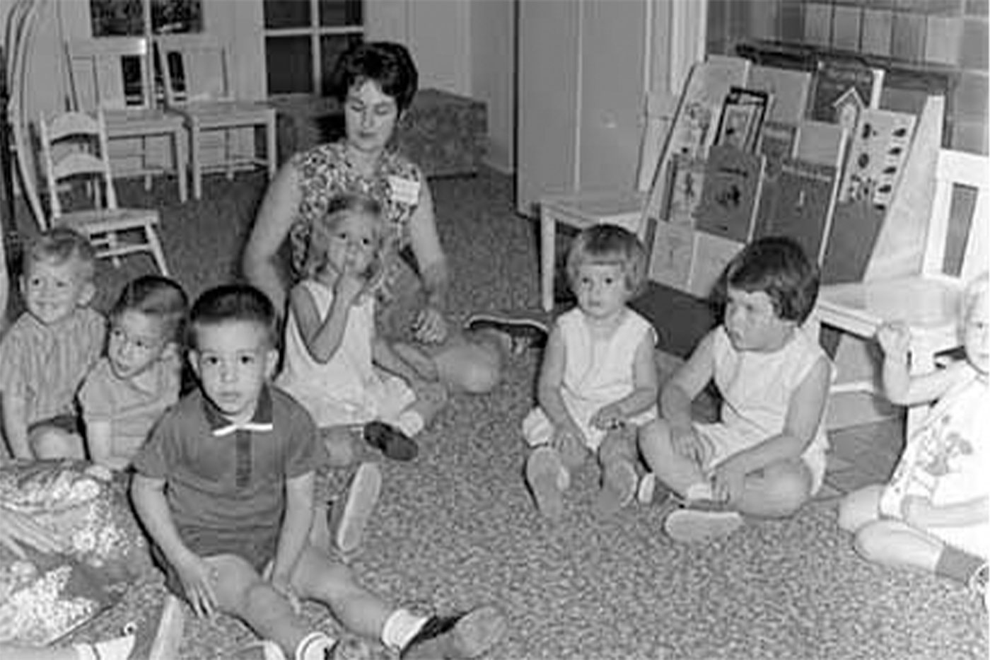 A Texas Tech home economics student sits with a group of children in what was then called the Nursery School. Image courtesy of the Southwest Collection/Special Collections Library.