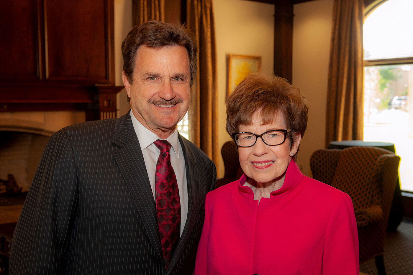 Haley poses with Texas Tech President Lawrence Schovanec during her retirement party.