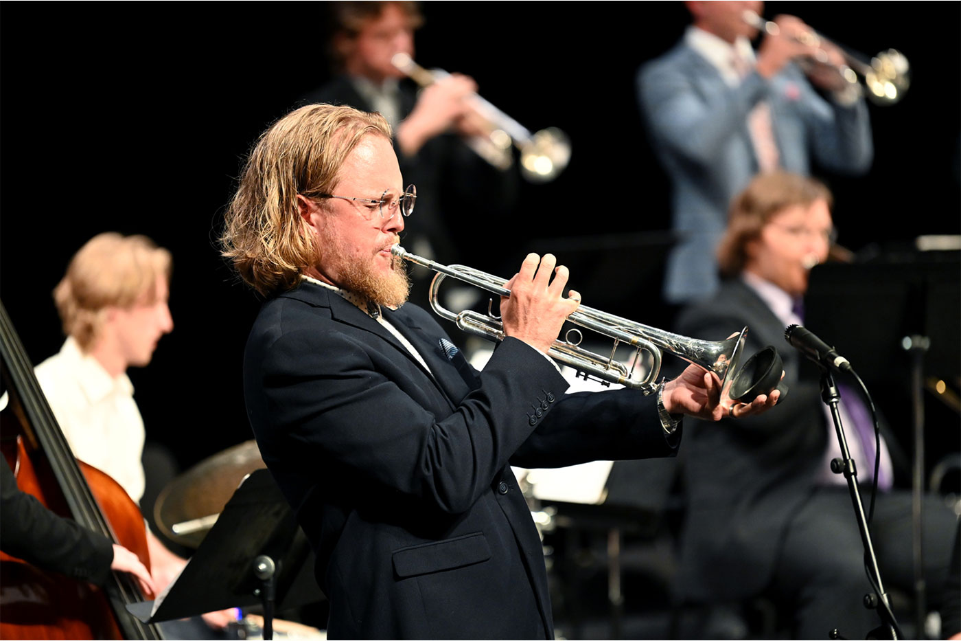 Musician blowing trumpet